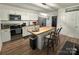 Contemporary kitchen with stainless steel appliances, an island with bar seating, and ample cabinet space at 918 8Th St # 5, Lancaster, SC 29720