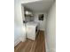 Convenient laundry room with washer, dryer, and shelving for storage of supplies at 918 8Th St # 5, Lancaster, SC 29720