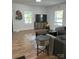 Bright living room with modern decor, wood-look flooring, and large windows at 918 8Th St # 5, Lancaster, SC 29720