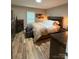 Relaxing main bedroom features wood-look floors and a view of the backyard at 918 8Th St # 5, Lancaster, SC 29720