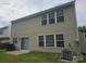 Backyard view of the house featuring siding, windows, and a sliding glass door at 9237 Bellegarde Dr, Charlotte, NC 28277