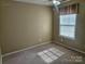 Neutral bedroom with carpet, ceiling fan, and large window providing sunlight at 9237 Bellegarde Dr, Charlotte, NC 28277