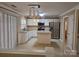 Updated kitchen featuring stainless steel appliances, granite countertops, and a center island at 9237 Bellegarde Dr, Charlotte, NC 28277
