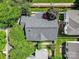 A perfect aerial view of the property showcasing a well-maintained roof and verdant surrounding landscape at 9360 Meadowmont View Dr, Charlotte, NC 28269