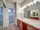 Well-lit bathroom featuring an extended vanity with drawers and cabinets plus a step-in shower at 9360 Meadowmont View Dr, Charlotte, NC 28269