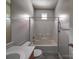 Bathroom with a combined tub and shower, along with a neutral color palette at 9360 Meadowmont View Dr, Charlotte, NC 28269