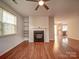 Inviting living room featuring a cozy fireplace and open layout, perfect for relaxing and entertaining guests at 9360 Meadowmont View Dr, Charlotte, NC 28269