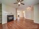 Inviting living room featuring a cozy fireplace and open layout, perfect for relaxing and entertaining guests at 9360 Meadowmont View Dr, Charlotte, NC 28269