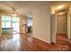 Open-concept living room flows into kitchen with sliding glass doors, offering ample space and light at 9360 Meadowmont View Dr, Charlotte, NC 28269