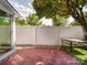 Enjoy this outdoor patio, perfect for entertaining with a table and fenced yard at 9360 Meadowmont View Dr, Charlotte, NC 28269
