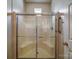 Clean, modern glass shower with built-in seating and chrome fixtures is move-in ready at 9360 Meadowmont View Dr, Charlotte, NC 28269
