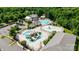 Aerial view of community water park, including a large pool, water slides, lounge chairs, and landscaped areas at 1001 Linn Cv, Waxhaw, NC 28173