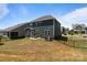 Home's backyard featuring a well-maintained lawn, fenced perimeter and a patio with seating and grill at 1001 Linn Cv, Waxhaw, NC 28173