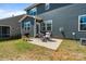 Backyard patio with comfortable seating and a grill, perfect for outdoor entertaining and relaxation at 1001 Linn Cv, Waxhaw, NC 28173