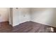 Empty bedroom with wood floors, closet, and doorway for easy customization at 1001 Linn Cv, Waxhaw, NC 28173