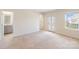 Open bedroom with neutral carpet, bathroom and large glass doors at 1001 Linn Cv, Waxhaw, NC 28173