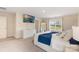 Bright bedroom with carpet, large window, a TV on the wall and a bed with blue accents at 1001 Linn Cv, Waxhaw, NC 28173