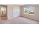 Cozy bedroom with a closet, a window that offers neighborhood views, and neutral carpeting at 1001 Linn Cv, Waxhaw, NC 28173