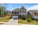 Charming two-story house with a classic design and a neatly landscaped yard at 1001 Linn Cv, Waxhaw, NC 28173