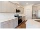 Elegant kitchen showcasing stainless steel appliances, white subway tile backsplash and gray cabinets at 1001 Linn Cv, Waxhaw, NC 28173