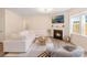 Bright living room with a fireplace, modern furniture, and plenty of natural light at 1001 Linn Cv, Waxhaw, NC 28173