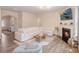 Open concept living room with a fireplace, plenty of seating, and hardwood floors at 1001 Linn Cv, Waxhaw, NC 28173
