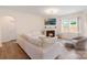 Comfortable living room with a cozy fireplace and ample seating at 1001 Linn Cv, Waxhaw, NC 28173