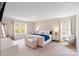 Spacious bedroom featuring natural light, carpet floors, and views from two large windows at 1001 Linn Cv, Waxhaw, NC 28173