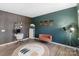 Cozy home office features a unique accent wall and stylish decor at 1001 Linn Cv, Waxhaw, NC 28173