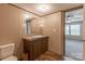 Bathroom with lighted vanity, toilet and shower at 105 Peridot Dr, Statesville, NC 28625