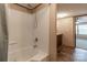Bright bathroom features a shower and tub combination and neutral wall coloring at 105 Peridot Dr, Statesville, NC 28625