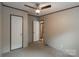 Cozy bedroom featuring carpet floors, neutral walls, and access to other rooms for a functional living space at 105 Peridot Dr, Statesville, NC 28625