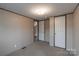 This bedroom offers neutral walls and carpet, plus access to another room at 105 Peridot Dr, Statesville, NC 28625