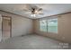 Bedroom with ceiling fan and views from the windows at 105 Peridot Dr, Statesville, NC 28625