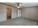 Bedroom with ceiling fan and access to the bathroom at 105 Peridot Dr, Statesville, NC 28625