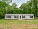 Charming single-story home with well-maintained lawn and landscaping at 105 Peridot Dr, Statesville, NC 28625
