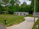 Charming single-story home features a spacious yard and long driveway at 105 Peridot Dr, Statesville, NC 28625