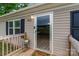 Close-up of front door, deck, house number and welcome mat at 105 Peridot Dr, Statesville, NC 28625