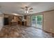 Spacious open-concept kitchen with hardwood floors, dark appliances, and an island for additional prep space at 105 Peridot Dr, Statesville, NC 28625