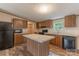 Well-equipped kitchen with island, ample cabinet space, and modern appliances at 105 Peridot Dr, Statesville, NC 28625