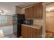 Kitchen featuring wood cabinets and black appliances at 105 Peridot Dr, Statesville, NC 28625