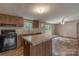 Open-concept kitchen features a peninsula with granite countertops and modern appliances, perfect for entertaining at 105 Peridot Dr, Statesville, NC 28625