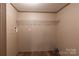 Functional laundry room with shelving offers essential storage and utility features, set against a neutral color scheme at 105 Peridot Dr, Statesville, NC 28625