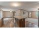 Spacious living room with an open layout combining hardwood and carpet flooring, leading to a well-lit dining area at 105 Peridot Dr, Statesville, NC 28625