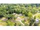 Aerial shot revealing a quaint property nestled amongst mature trees, featuring an expansive yard at 1094 Curve View Rd, Lincolnton, NC 28092