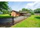 The backyard features a fenced yard, carport and plenty of space for outdoor activities and entertaining at 1094 Curve View Rd, Lincolnton, NC 28092
