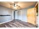 Spacious bedroom showcasing wood-look floors, neutral paint, closet and ceiling fan at 1094 Curve View Rd, Lincolnton, NC 28092