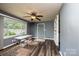 Comfortable dining area with wood-look floors, ceiling fan, and natural light from the large window at 1094 Curve View Rd, Lincolnton, NC 28092