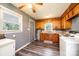 Efficient kitchen with white appliances, laminate floors and abundant cabinet storage at 1094 Curve View Rd, Lincolnton, NC 28092