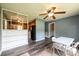 Inviting open-concept living area, featuring wood-look floors, view to the kitchen, and modern ceiling fan at 1094 Curve View Rd, Lincolnton, NC 28092